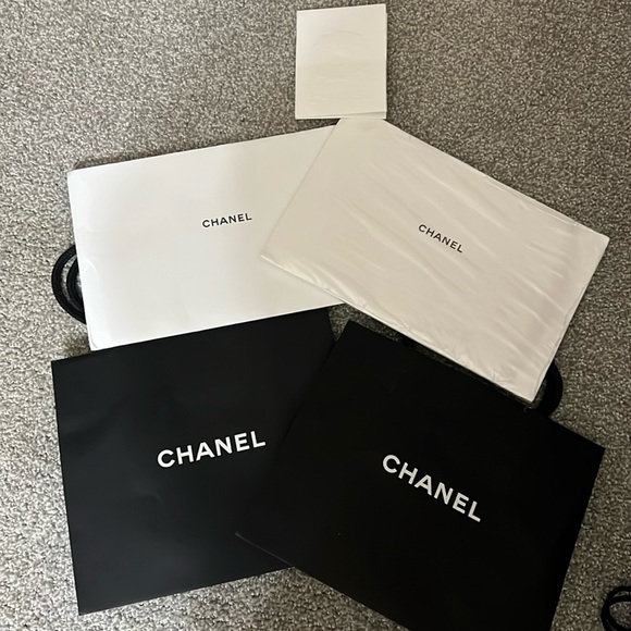 CHANEL Handbags - Chanel purse authentication pamphlet with 2 Chanel shopping bags.